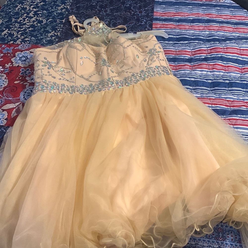 Short jeweled dress. Can be used for prom, wedding, or quince’s